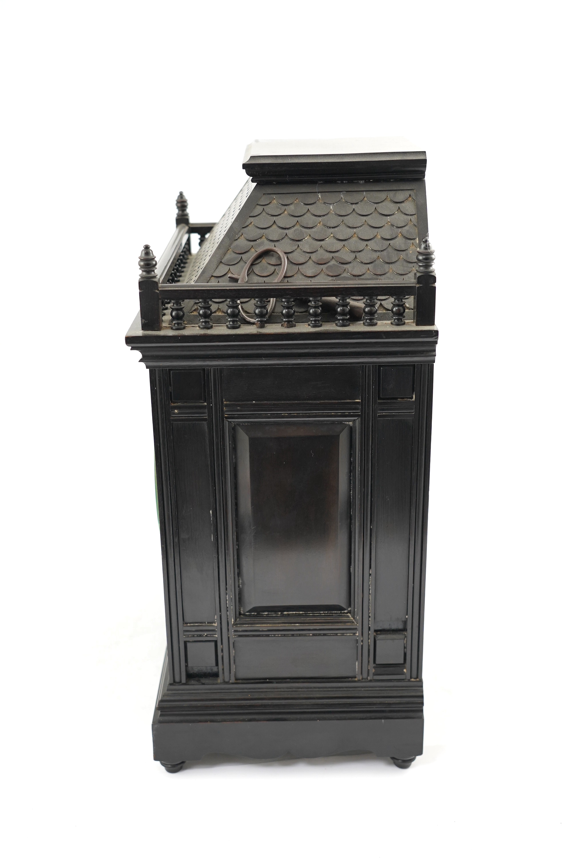 A Victorian Aesthetic Movement ebonised architectural mantel clock, probably designed by Lewis Foreman Day